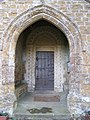 North door of church at Barford St. Michael, Oxfordshire. Gothic porch with Norman doorway. November 2009[a]