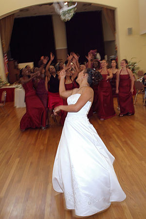 A bride tossing her bouquet of flowers. Catego...