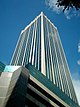 Ground-level view of a 45-storey, box-like building with a square cross section