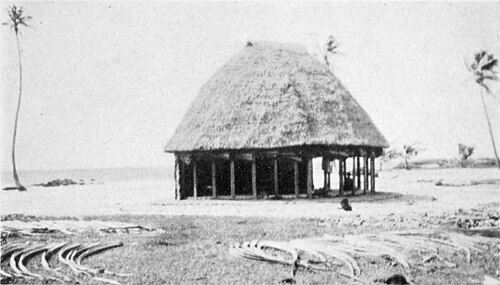 A photo of a hut in a clearing