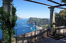 Islands such as Capri became popular in the late 14th century and first decade of the 19th century Overlooking Capri harbour from the rotunda in Villa San Michele Anacapri 2013.jpg