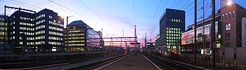 The city of Zurich, the most important economic center of the country and one of the world's major financial centers, hosts the SIX Swiss Exchange. Panorama altstetten-station-sundown.jpg