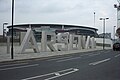 View of the South Bridge with the Arsenal statue lettering in the foreground and the Emirates Stadium in the background.