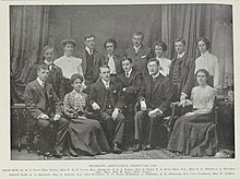 A black and white picture of fourteen members of the Victoria University College Students Association Committee in 1904.