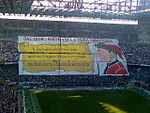 A Milan ultras' banner saying "Inter, the true comedy since 1908", accompanied by a caricature of Dante