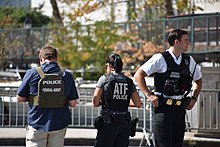 American federal law enforcement agents working together. Each federal LEA in the U.S. has a different focus and jurisdiction; for example, the Bureau of Alcohol, Tobacco, Firearms and Explosives (agent in center) investigates crimes involving alcohol, tobacco, and weaponry. A DSS agent coordinates with ATF and USSS special agents to secure delegate arrivals at UNGA in NYC, Sept. 23, 2019. (48788736523).jpg