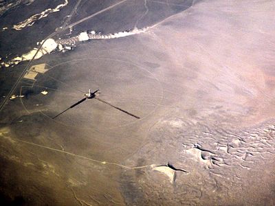 2012 January – The solar tower under construction as seen from a commercial airliner. The titular Crescent Dunes are at lower right.