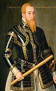 Den svenske Erik XIV (1533-1577) framstilt som mektig «krigerkonge» i rustning og skamkapsel, malt av Domenicus Verwilt (1544–1565). Legg merke til hvordan marskalkstaven er plassert slik at den kan tolkes som en potent fallos.