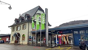 Three-story building with gabled roof