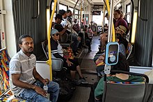 Interior of an articulated bus in Los Angeles Inside a LACMTA 720 Bus on relatively low traffic (cropped).jpg