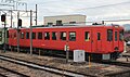Koumi Line KiHa 110–121 in "Metropolitan" all-over red livery in February 2015