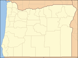 A map of Oregon with a red dot in the southwest