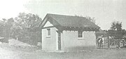 The small barn next to a horse corral (1930s).