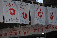 Red Hand Day, the International Day Against Use of Child Soldiers, is often marked by displaying red handprints. Red Hand Day - Kinder sind keine Soldaten.jpg