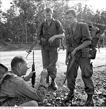 New Zealand Forward Observers with a Sergeant from 7RAR, Vietnam 1967 Royal New Zealand Artillery gunners briefed by a 7RAR sergeant.jpg