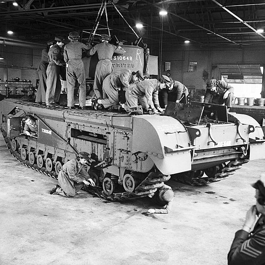 Auxiliary Territorial Service (ATS) women working on a Churchill tank at a Royal Army Ordnance Corps depot, 10 October 1942, by Lt. Taylor, War Office official photographer; restored by Adam Cuerden Nick-D rightfully called this out as a posed publicity photo, which is almost certainly true. But the unfortunate thing about historical imagery is that whatever gets passed down to us is all we get.