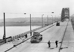 British XXX Corps cross the road bridge at Nijmegen.jpg