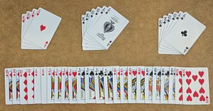 A 40-card Doppelkopf deck showing the three non-trump suits (four hearts, six spades, and six clubs), and the larger trump suit.
