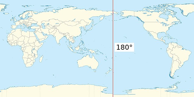 A map of the Earth with the Pacific Ocean in the centre, with a vertical red line running the full height just west of the Bering Strait and east of New Zealand.