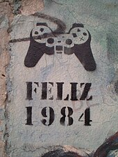 "Happy 1984" in Spanish or Portuguese, referencing George Orwell's Nineteen Eighty-Four, on a standing piece of the Berlin Wall (sometime after 1998) Feliz 1984.JPG
