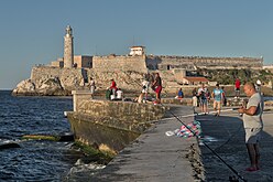 Cubans fishing next to the castle