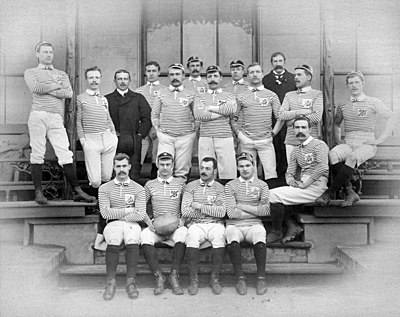 A body or rugby union players posing in uniform before a match