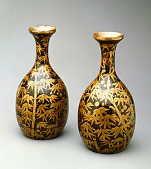 A pair of sake flasks painted in gold and black lacquer. Momoyama period, 16th century. Pair of Sake Flasks Momoyama Period Yale University Art Gallery.jpg