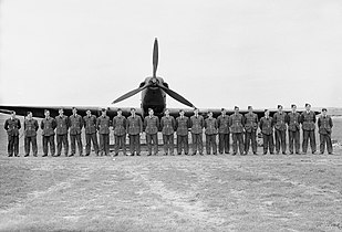 Officers of No. 103 Squadron RAF lined up at Betheniville.[l]