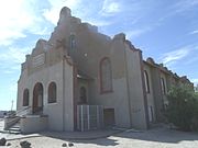 Side view of the C. H. Cook Memorial Church, a historic church on Church Street. It was built in 1918 and added to the National Register in 1975. The church is named after Charles Cook a young missionary who arrived in Sacaton on December 23, 1870. The funeral of Ira Hayes was held there. The church was listed in the National Register of Historic Places on August 28, 1975, reference # 75000359.