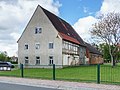 Nördliches Wohnhaus mit angebautem Seitengebäude und östliches Auszugshaus mit angebautem Seitengebäude eines ehemaligen Vierseithofes (Storchenhof)