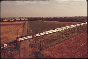 THE LONE STAR (TRAIN ^15) IS SHOWN FROM THE AIR AS IT PASSES A TYPICAL RURAL OKLAHOMA CROSSING BETWEEN GUTHRIE AND... - NARA - 556029.jpg