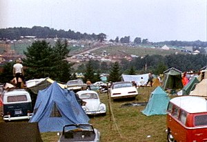 Tents at the Woodstock Festival. Volkswagens w...
