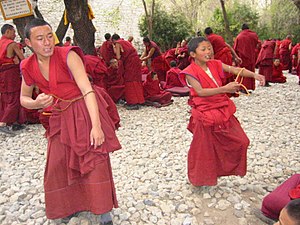 Young Buddhist monks in Tibet practising formal debating Young monks of Drepung.jpg