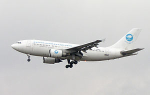 An Ariana Afghan Airlines aircraft flying over...