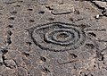 Cup and ring petroglyph in lava rock, island of Hawaii, US