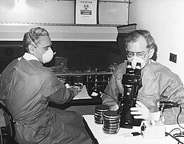 The advent of the microscope was one of the major developments in the history of pathology. Here researchers at the Centers for Disease Control in 1978 examine cultures containing Legionella pneumophila, the pathogen responsible for Legionnaire's disease. Gorman and Feeley.jpg