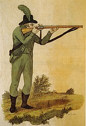 Green-jacketed rifleman firing Baker rifle 1803 Green jacketed rifleman firing Baker rifle 1803.jpg