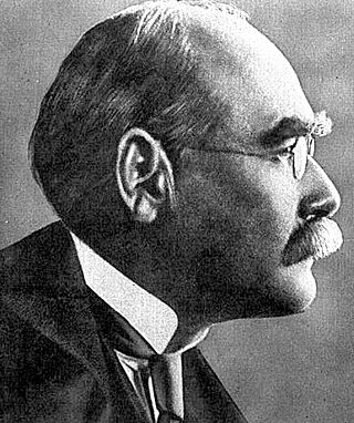 Profile of the balding head of a man in a high collar, tie and coat and with a serious expression. He has bushy eyebrows and a moustache.