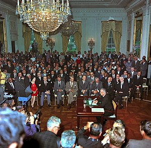 President Lyndon B. Johnson at the signing the...