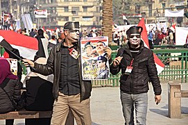 Sisi-Masken und Plakat mit Nasser, Sadat und Sisi[408]