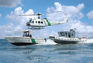 A Helicopter and two boats of the U.S. Customs...
