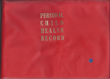 The front cover of a book, with a solid red background and the words 'PERSONAL CHILD HEALTH RECORD' in gold serif justified typeface on alternating lines. A small blue circular sticker is present in the bottom right.