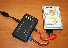 A portable Tableau write-blocker attached to a hard drive Portable forensic tableau.JPG