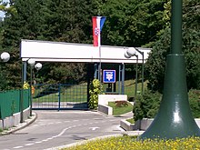 Standard of the president of Croatia flown at the entrance to the Presidential Palace grounds Predsjednicki dvori Zagreb glavni kolni ulaz.jpg