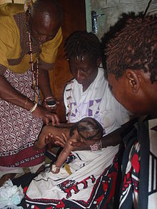 Sangoma performing a traditional baptism in Alexandra, Johannesburg Sangoma performing a Baptism.jpg