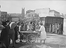 Shopping in wartime Plymouth, May 1943 Shopping in Plymouth, England after WWII bombing, May, 1943.jpg