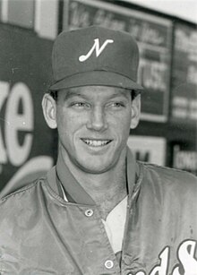 A black and white photograph of a baseball player