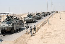 A convoy of Strykers traveling between Iraq and Kuwait during the Iraq War in 2010 Convoy from Baghdad to Kuwait DVIDS310958.jpg