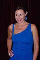 A color photograph of American television personality Luann de Lesseps being pictured at a 2011 event.