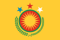 Rojava's former emblem superimposed on a yellow-orangeish background